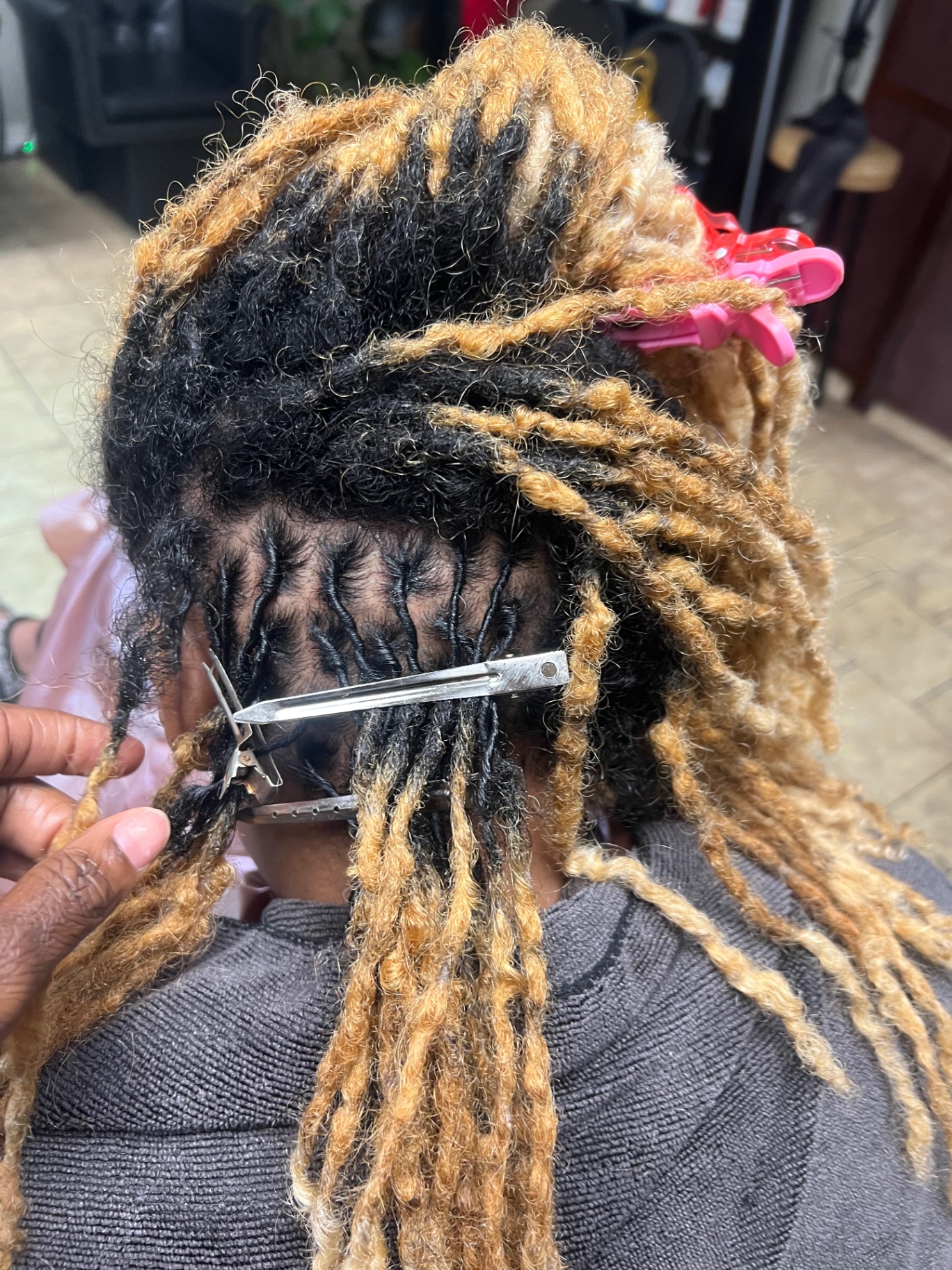 Fresh loc retwist with blonde and black blend