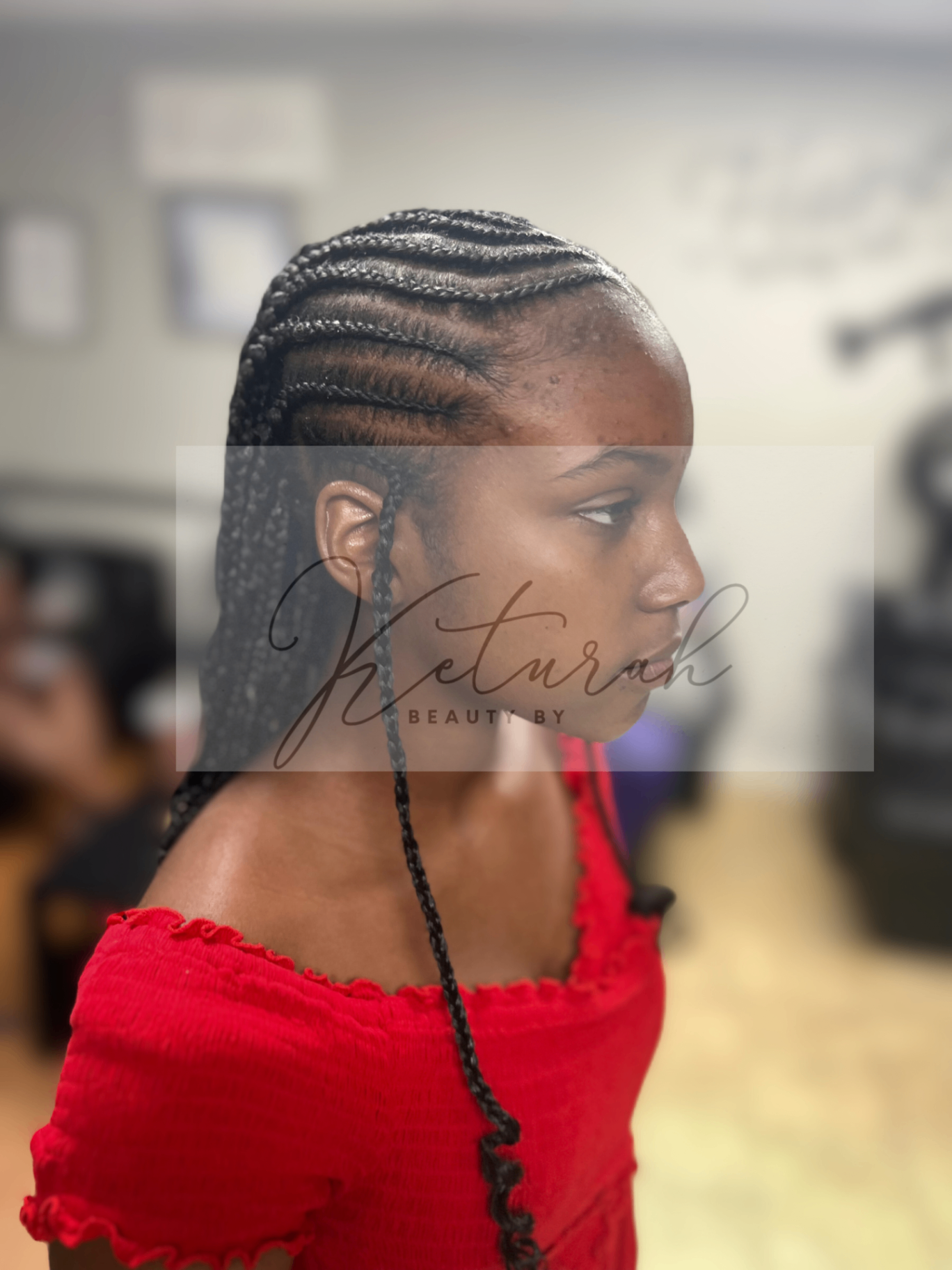 Sleek feed-in cornrows styled to the side
