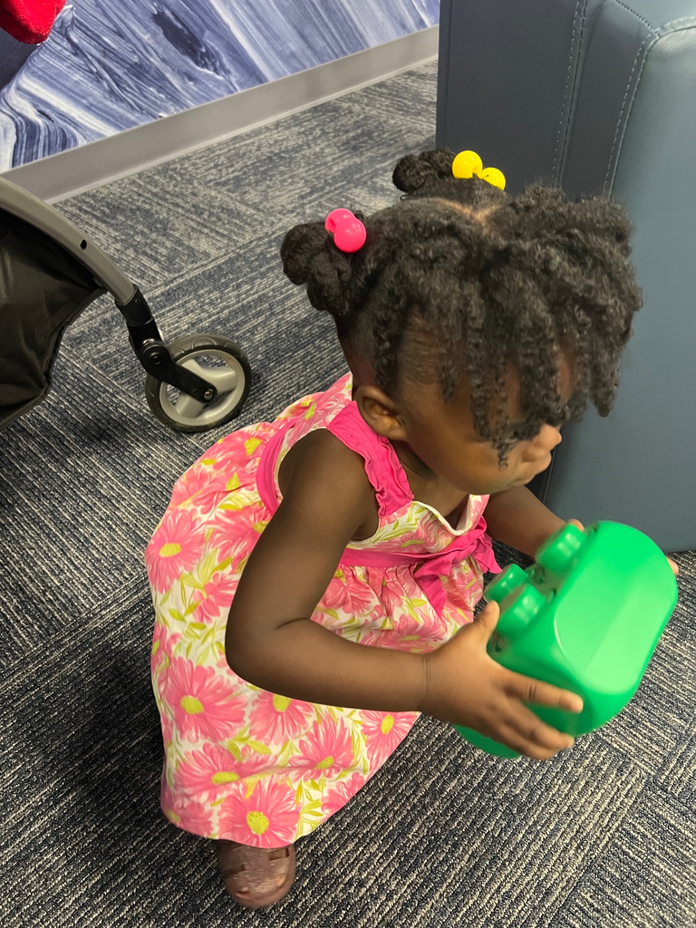Two-strand twist puffs styled for a toddler